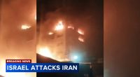 Israel says Iran has launched 100 drones as air raid sirens blare across country