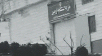 The gate of Evin Prison in Iran is blown open.