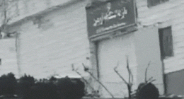 The gate of Evin Prison in Iran is blown open.