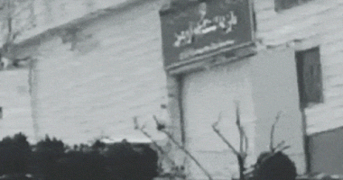 The gate of Evin Prison in Iran is blown open.