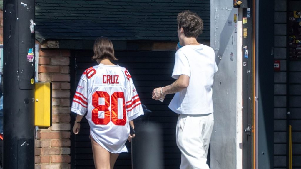 Jackie Apostel supports Cruz Beckham by wearing his jersey