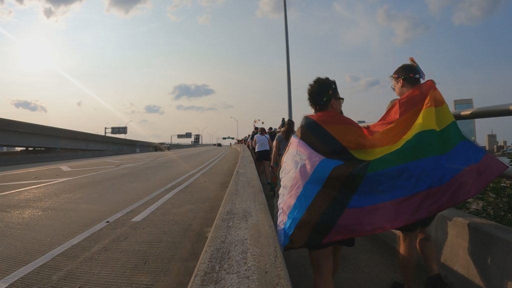 Jacksonville LGBTQ+ community marches, lights up Acosta Bridge for Pride month