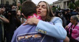 Karen Read embraces a supporter.