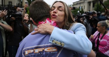 Karen Read embraces a supporter.
