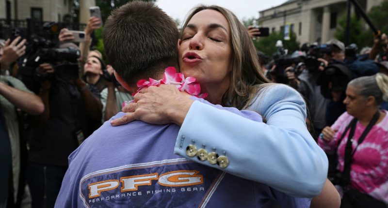 Karen Read embraces a supporter.
