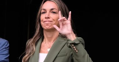 Karen Read holds up a hand sign.