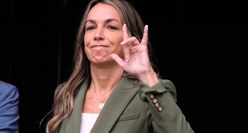 Karen Read holds up a hand sign.