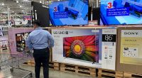 Key inflation gauge rose last month while Americans cut back on spending