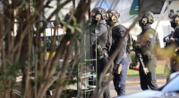 A man has been shot by police during a seige at a carvan park in Sydney's south-west.