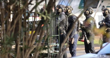 A man has been shot by police during a seige at a carvan park in Sydney's south-west.