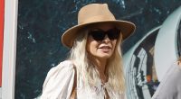 Margot Robbie looks fab in a black mini as she hosts Glasto part