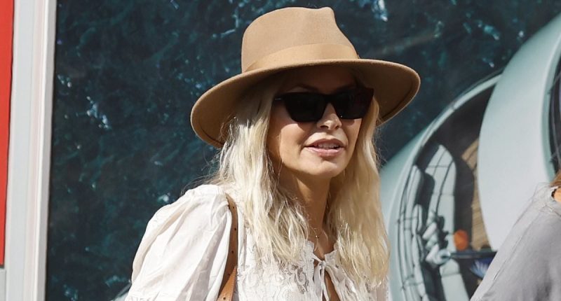 Margot Robbie looks fab in a black mini as she hosts Glasto part
