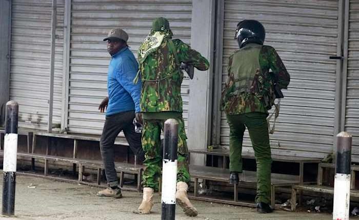 Photos capture the shooting of a civilian by a Kenyan police officer amid protests