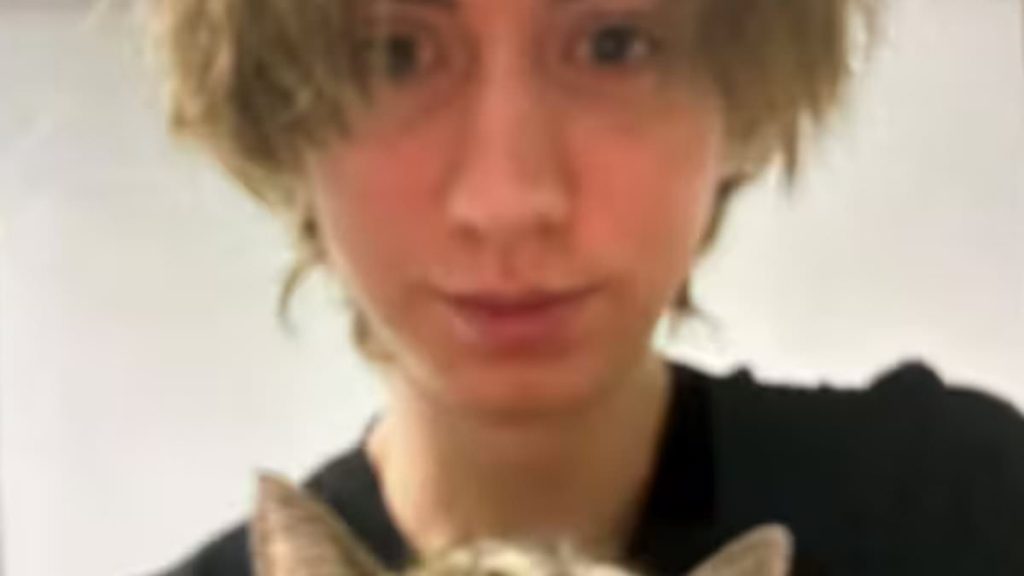 Pictured: Austrian school shooter holds his pet cat as it's revealed he asked mother 'forgive me for what I am about to do' in farewell message and begged that his treasured pet would be taken care of