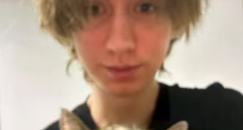 Pictured: Austrian school shooter holds his pet cat as it's revealed he asked mother 'forgive me for what I am about to do' in farewell message and begged that his treasured pet would be taken care of