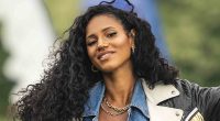 Pregnant Vick Hope shows off her baby bump in a vibrant yellow and red striped mini dress as she poses for new campaign