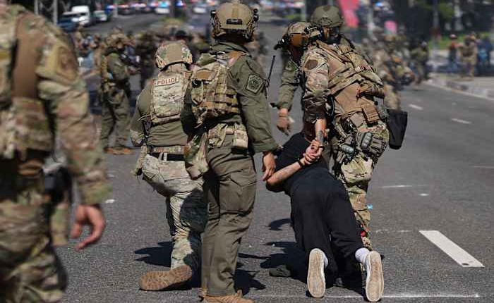 Protesters and immigration authorities face off for a second day in LA area after arrests