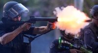 Reporter hit as LA officers fire rubber bullets at protesters