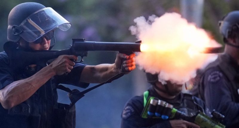 Reporter hit as LA officers fire rubber bullets at protesters