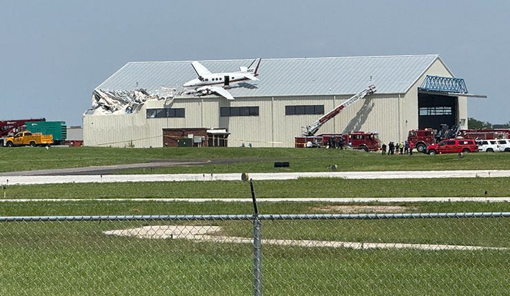 Small plane crashes onto hangar roof at Kansas airport