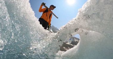 Switzerland's ebbing glaciers show a new, strange phenomenon: Holes reminiscent of Swiss cheese