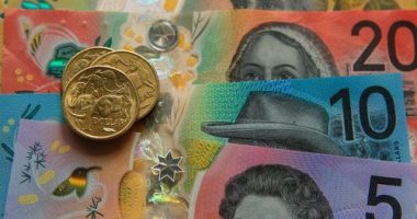 Australian $50, $20, $10 and $5 banknotes and dollar coins.