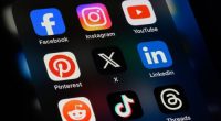 Toronto, Canada - September 24, 2023:  Popular social media apps on an Apple iPhone: Facebook, Instagram, YouTube, Pinterest, X (formerly Twitter), LinkedIn, Reddit, TikTok, and Threads.