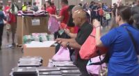 Volunteers fill backpacks for 25K Central Florida students