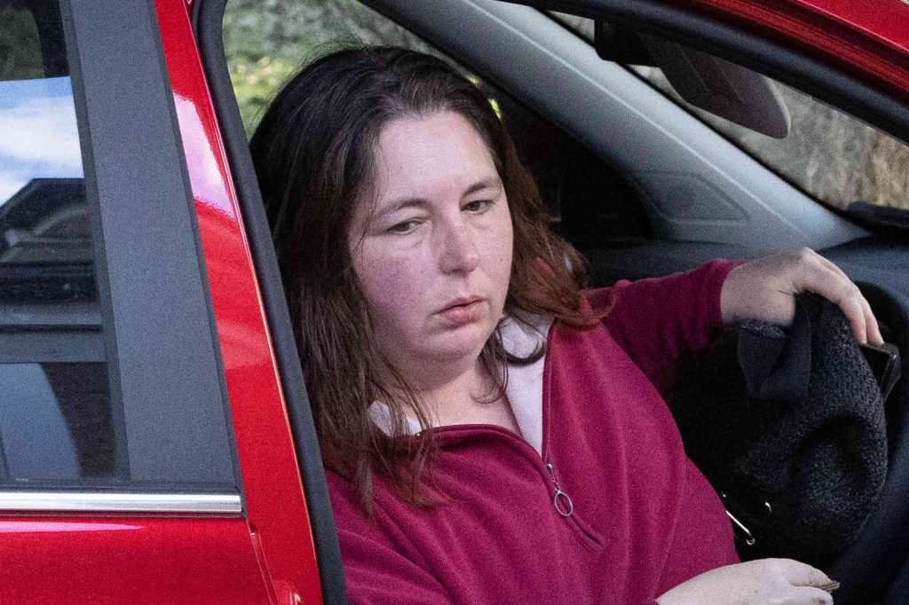 Erin Patterson getting out of her car.