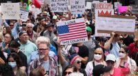 Woman charged in connection to anti-ICE protest where car drove through crowd