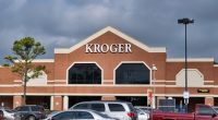 Kroger storefront with cars in the parking lot.