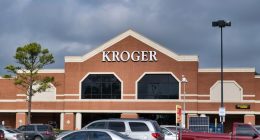 Kroger storefront with cars in the parking lot.