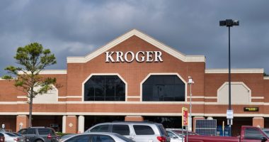 Kroger storefront with cars in the parking lot.