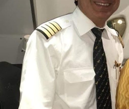 Portrait of Captain Sumeet Sabharwal in a pilot uniform.