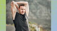 mature man stretching outdoors while on a run