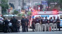 NYPD officers at a New York City shooting scene.