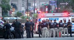 NYPD officers at a New York City shooting scene.