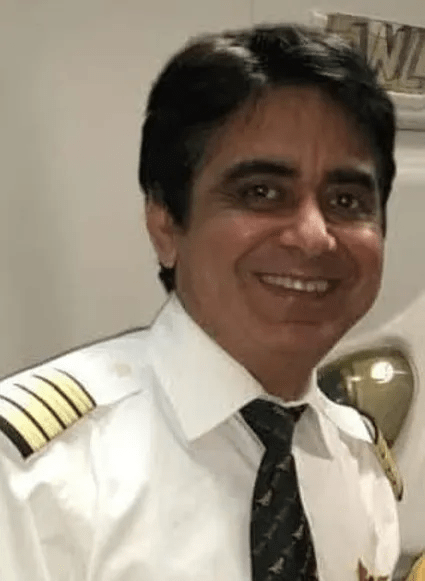 Portrait of a smiling pilot in uniform.