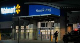 Law enforcement officer at a Walmart crime scene.