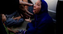 Woman mourning at hospital after deadly incident in Gaza.