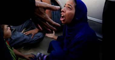Woman mourning at hospital after deadly incident in Gaza.