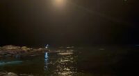 Nighttime search and rescue operation at sea.