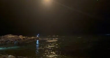 Nighttime search and rescue operation at sea.