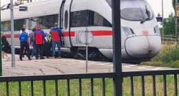 Passengers and first responders at an ICE train following an axe attack.