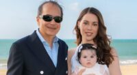 Billionaire poses with glamorous new fiancee and their BABY