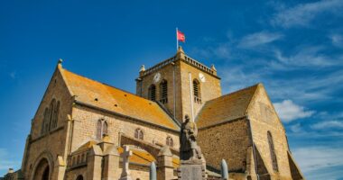 Normandy, France, August 31, 2019: Looking at the St-Nicolas church at the city of Barfleur. It is a French commune in the department of Manche in the Normandy region. it is classified as one of the Plus beaux villages de France - most beautiful villages in France.