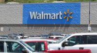 A Walmart store with a full parking lot.