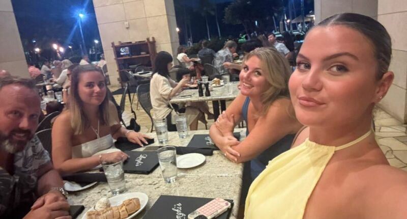 Family at an outdoor restaurant.
