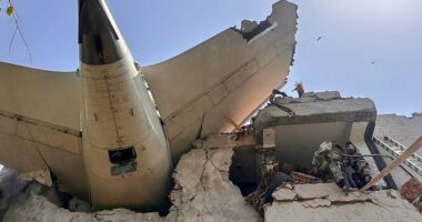 Debris of an Air India plane embedded in a building after a crash.