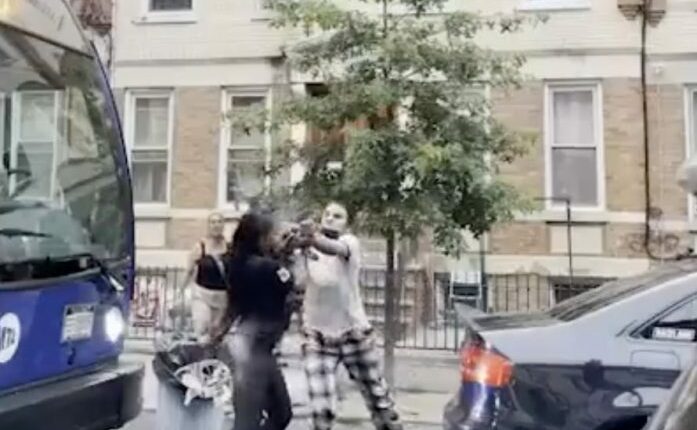 Street brawl between several women over a parking spot.
